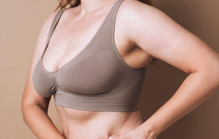 woman posing sideways in compression bra